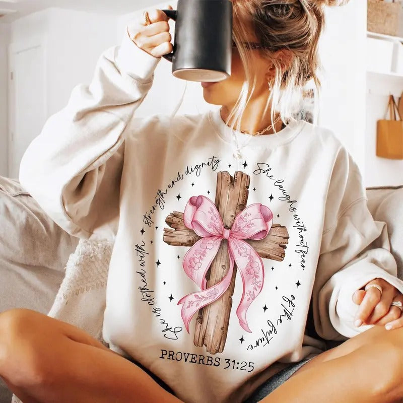 She is Clothed with Strength and Dignity Jesus Faith Sweatshirt, She Is Bible Verse Pink Bow Cross Sweatshirt, Christmas God Faith Sweater